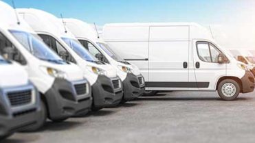 Delivery vans in a row with space for logo or text. Express delivery and shipment service concept. 3d illustration