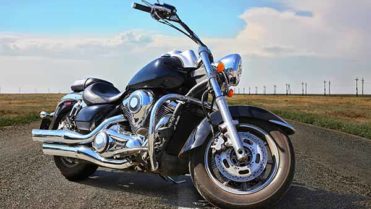 powerful black motorcycle on highway in country